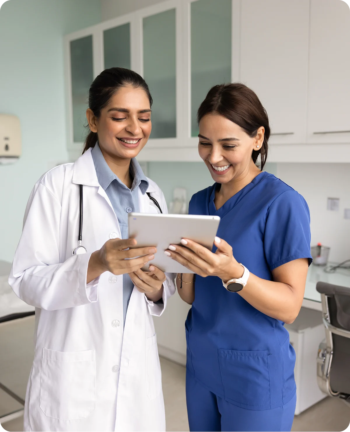 Doctors reviewing information on a tablet.